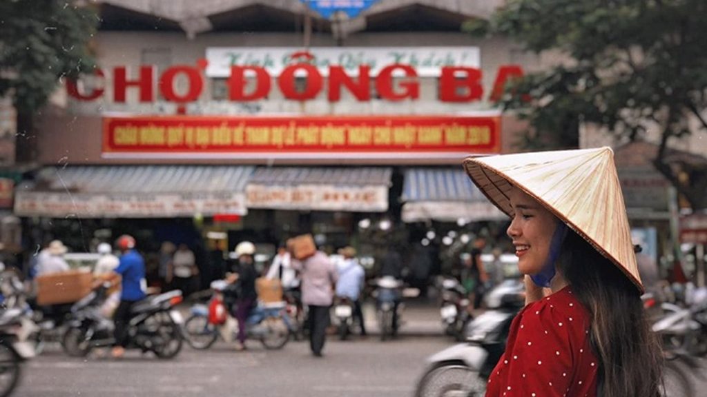 Vibrant scene at Dong Ba Market, showcasing various souvenirs and street food vendors