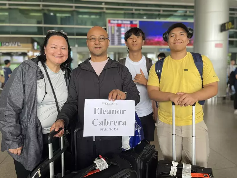 Driver holding name sign at Da Nang Airport for private transfer to Four Seasons Resort The Nam Hai
