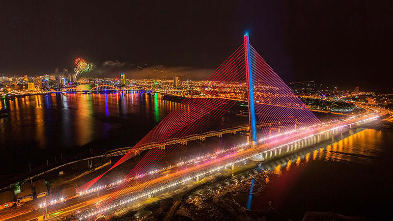 At night, the bridge lights up, creating a truly vibrant and magnificent scene