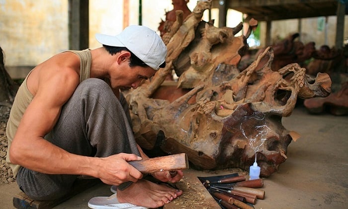 Artisans meticulously carve and drill to create products