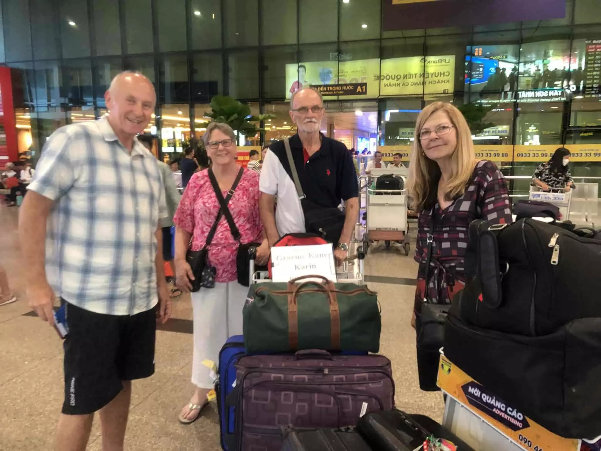 Private car driver holding a welcome sign at Da Nang International Airport arrivals gate