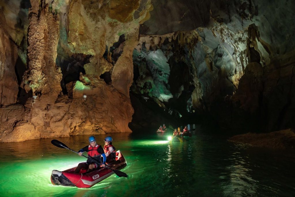 Kayaking in the underground stream inside Paradise Cave, Quang Binh.