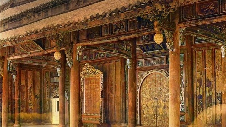 Dai Cung Mon gate of the Forbidden Purple City in Hue, featuring wooden architecture with intricate carvings.