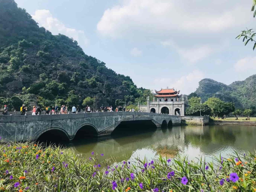 View of ancient temples at Hoa Lu Ancient Capital, surrounded by lush vegetation.