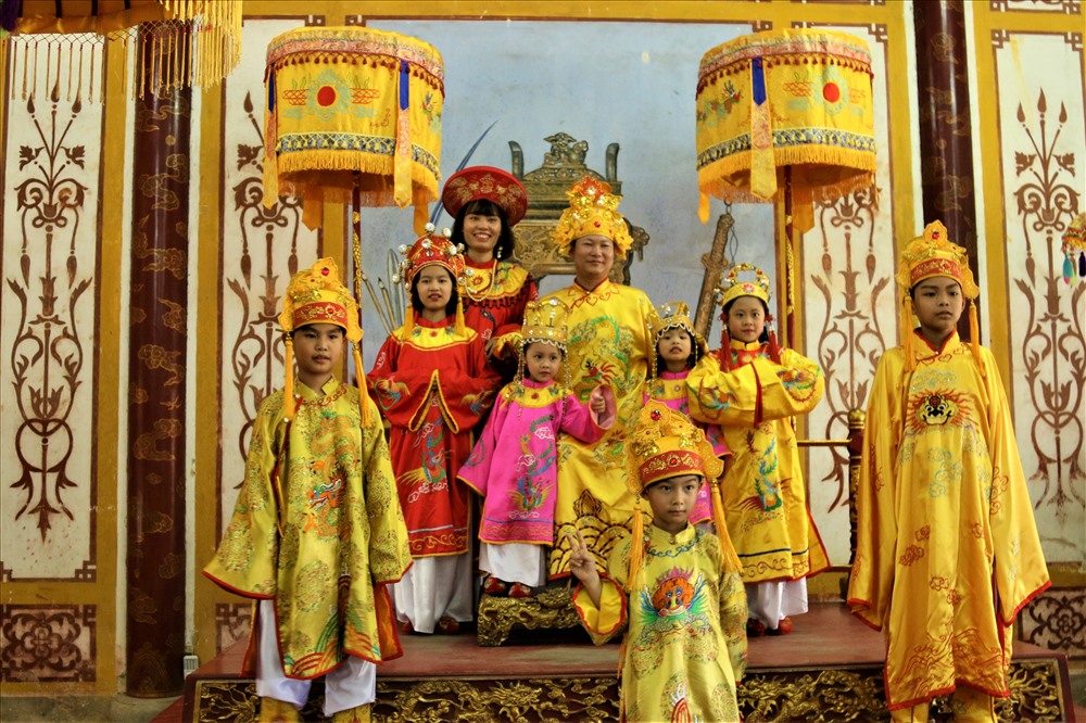 Tourists wearing traditional royal costumes for a photo shoot at the Imperial City of Hue.