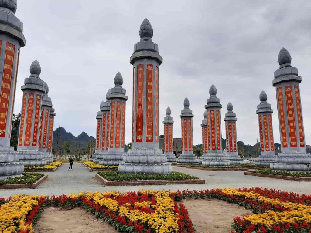 Garden of Kinh Pillars at Tam Chuc Pagoda, featuring large stone pillars inscribed with Buddhist scriptures.