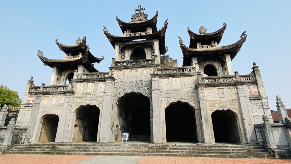 Exterior of Phat Diem Stone Cathedral with a mix of Eastern and Western architectural elements.